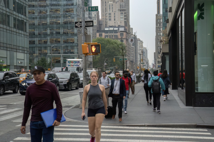 New Yorkers crossing the street with a red light in Manhattan