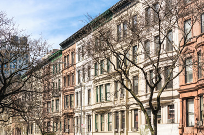 A Manhattan street of traditional apartment buildings.