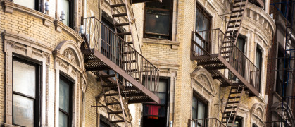 Old apartment building with fire escapes, Manhattan, New York City