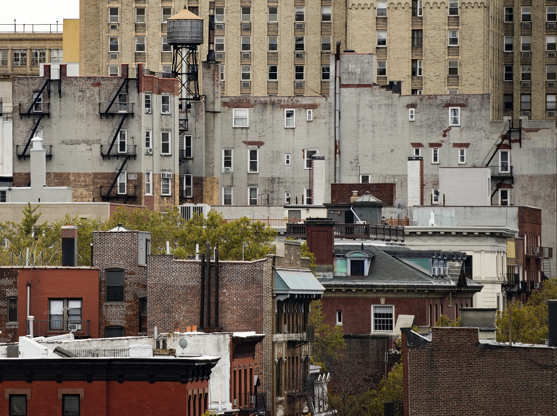 New York's skyscrapers with water tanks on the roof of some buildings. Manhattan, New York City, USA.