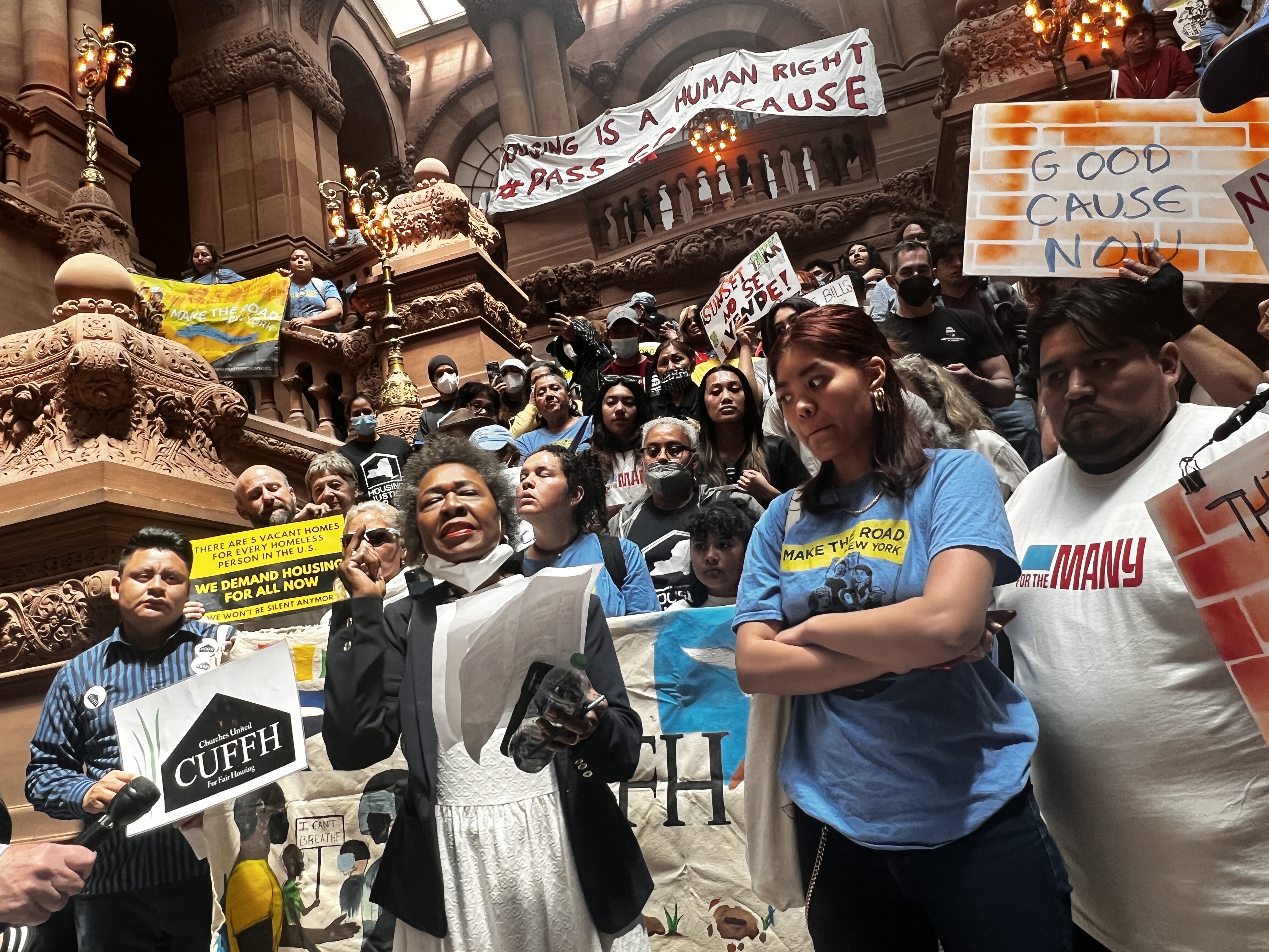 Tenant reform advocates with banners calling for good cause eviction laws in Albany
