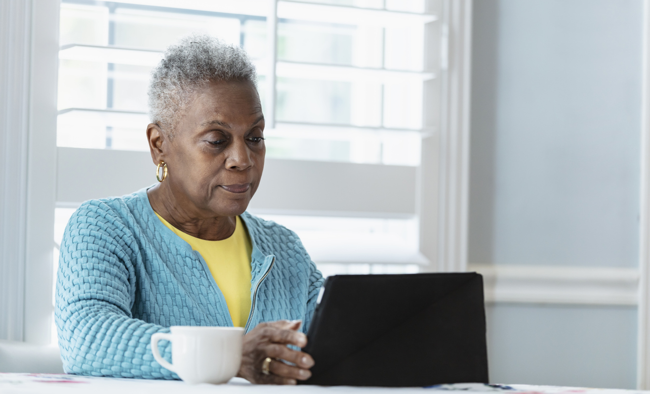 Black woman using digital tablet