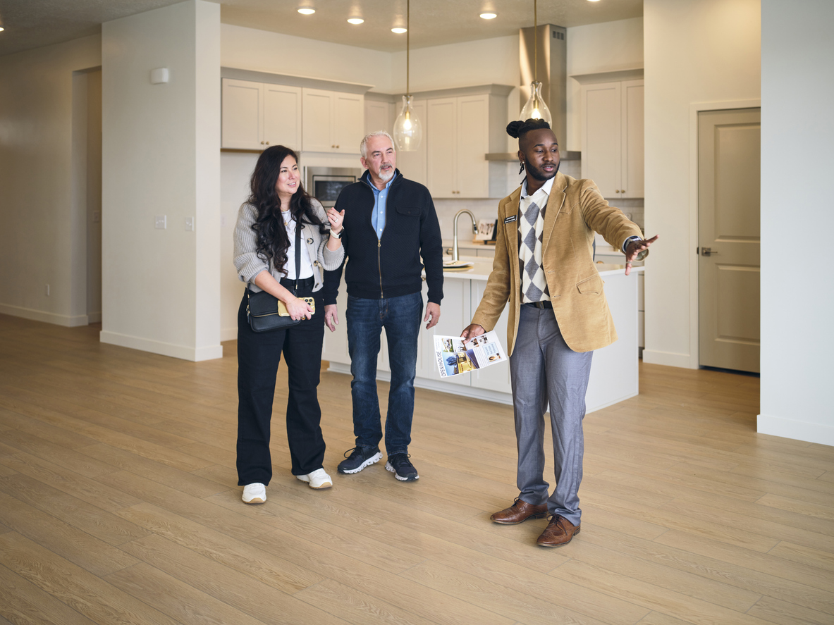 Agent showing a property to prospective buyers