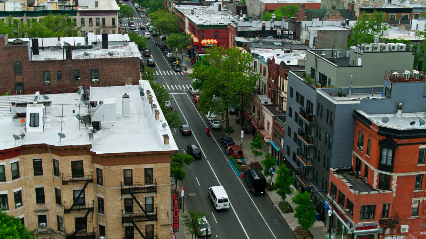 New York City on a hazy day in summer, following traffic on Nostrand Avenue in Crown Heights, Brooklyn. New York City on a hazy day in summer, following traffic on Nostrand Avenue in Crown Heights, Brooklyn.