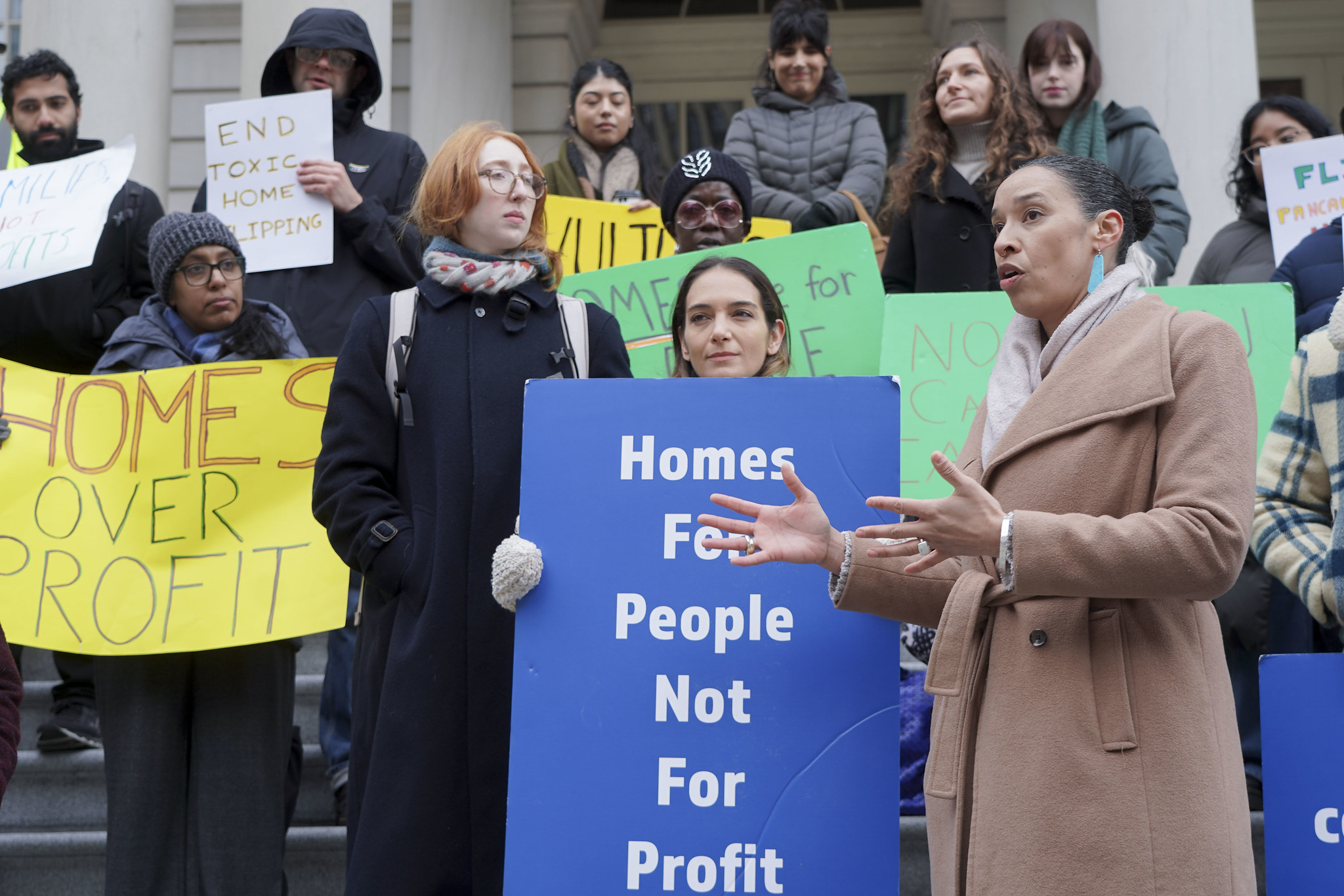 A rally in support of the End Toxic Flipping Act at City Hall