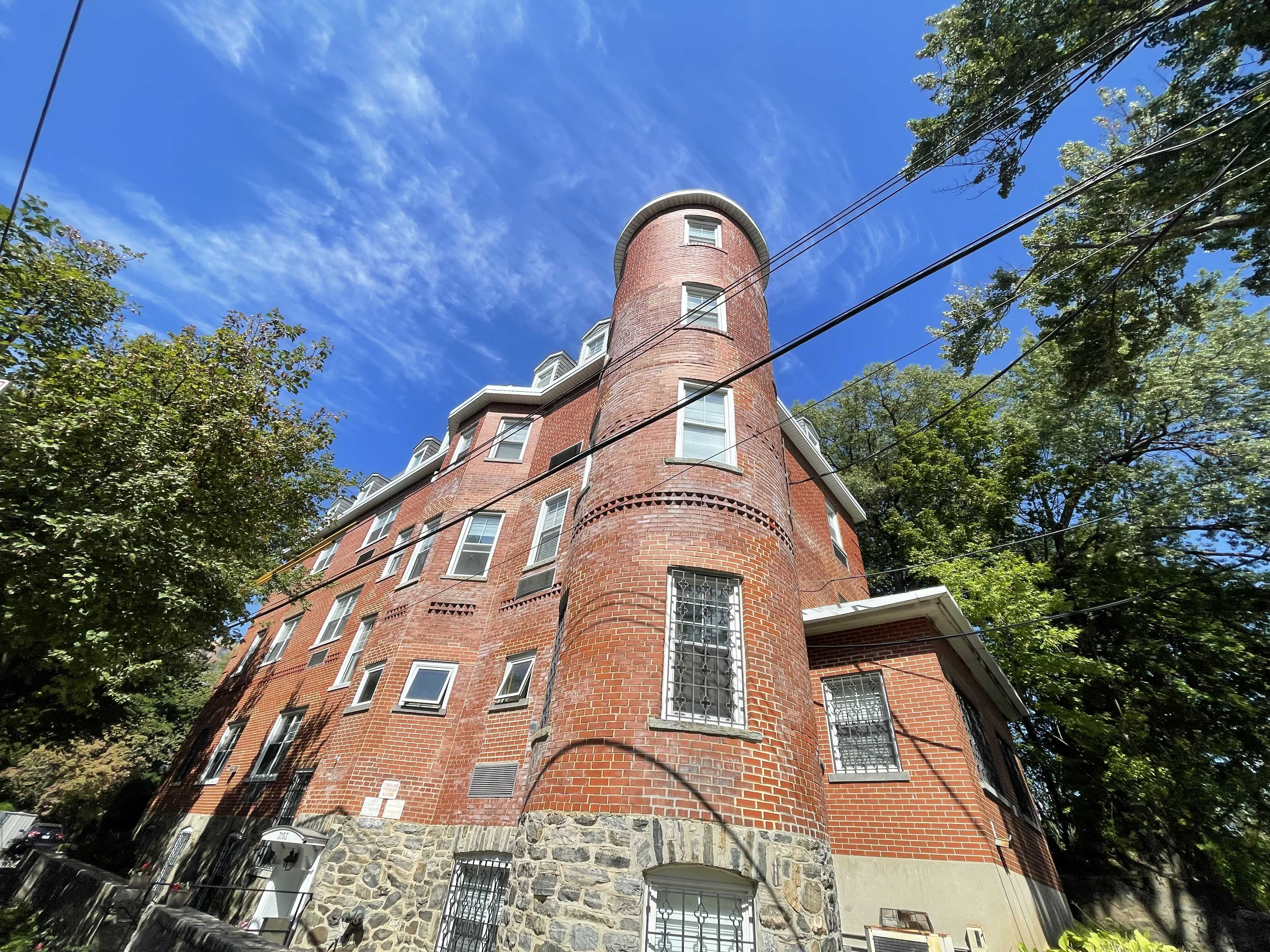 Boarding house Centro Maria reopened in Spuyten Duyvil in the Bronx after closing its Hell’s Kitchen location during the pandemic. A photo of Centro Maria's brick building in the Bronx.
