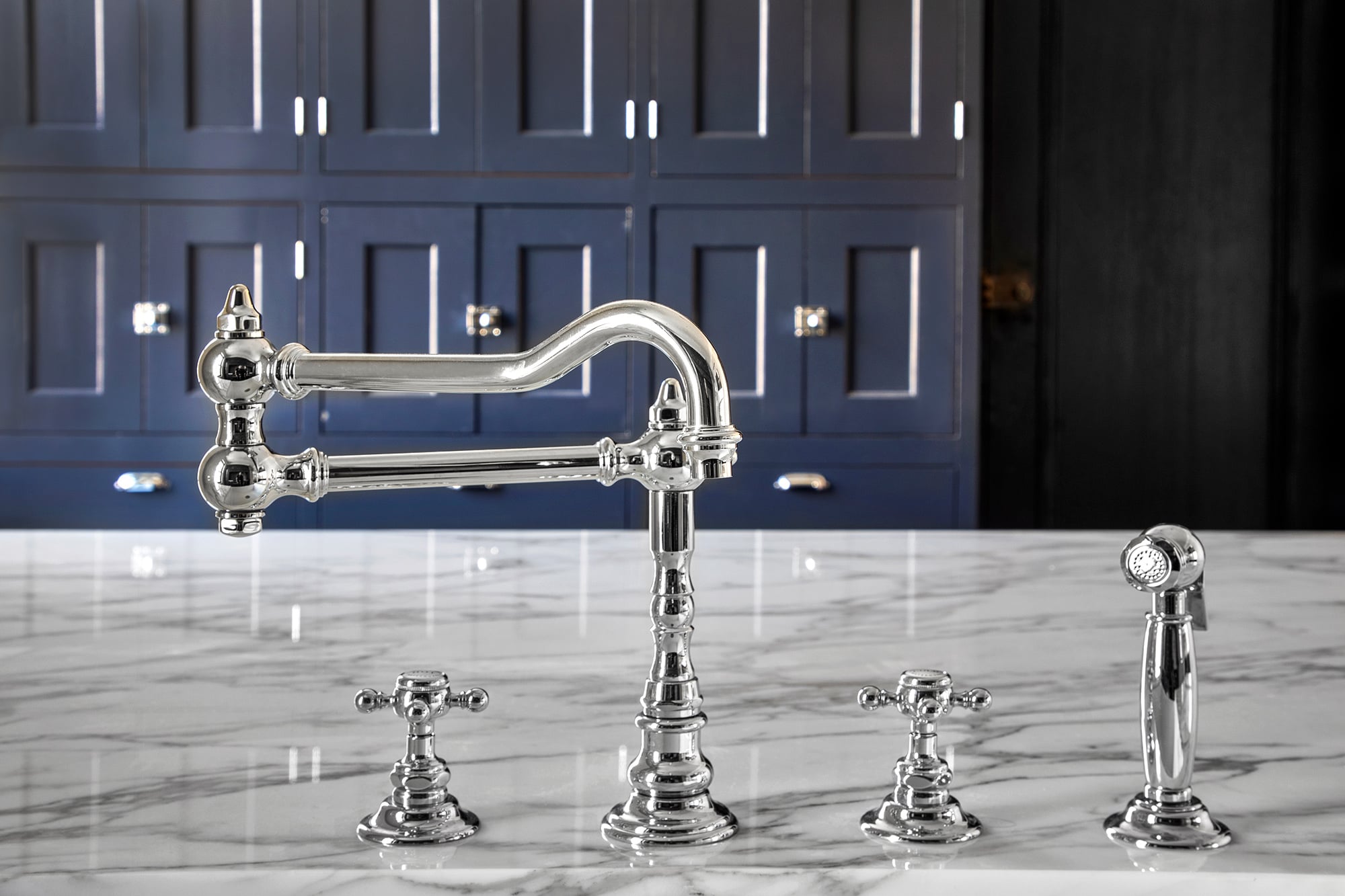 high-gloss faucet fixture on a marble countertop