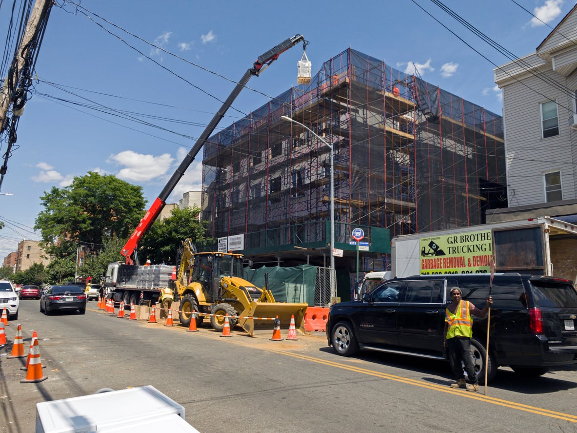 Construction work with a crane on new building in the Bronx NY