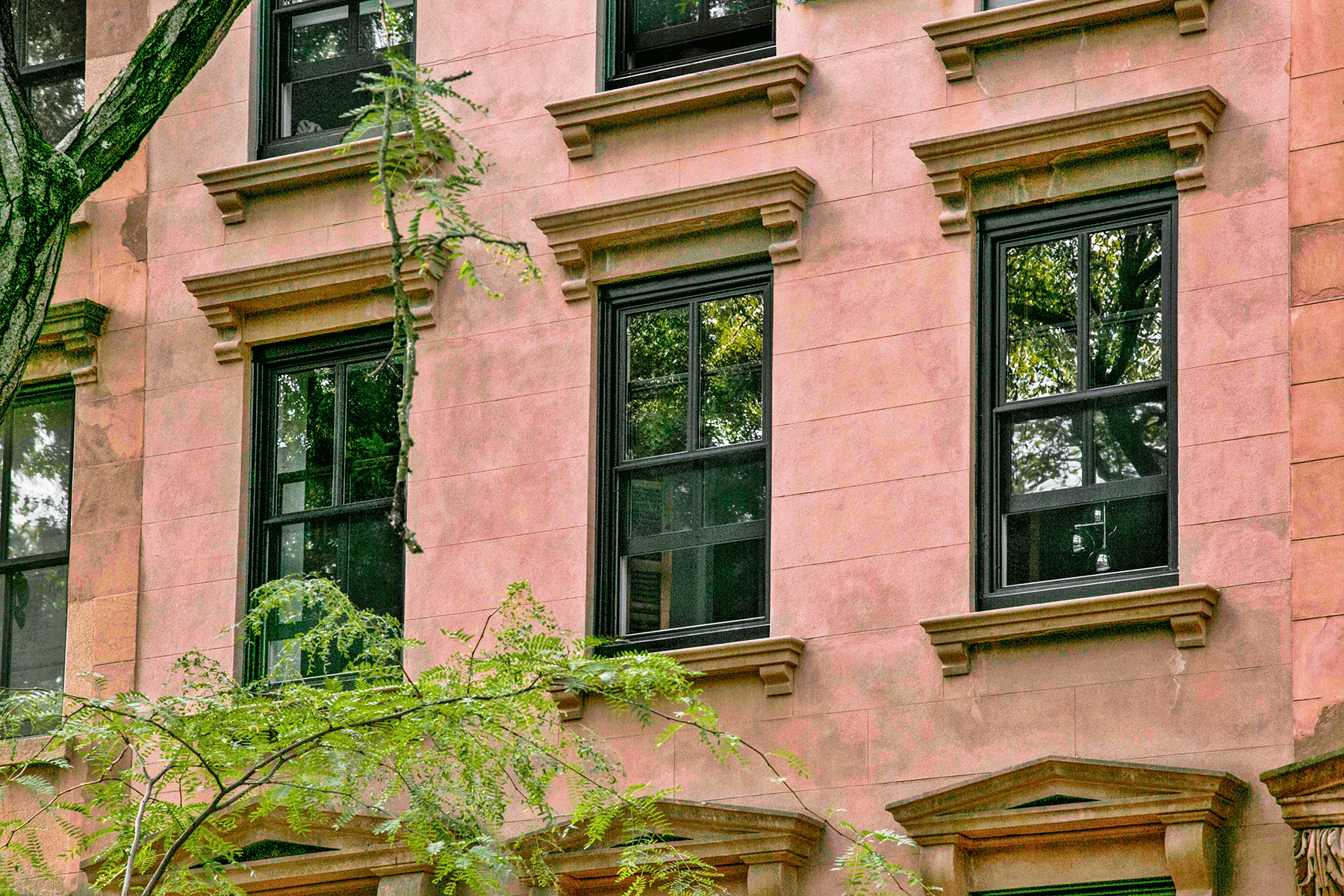 Well brownstone from the outside with black-framed windows