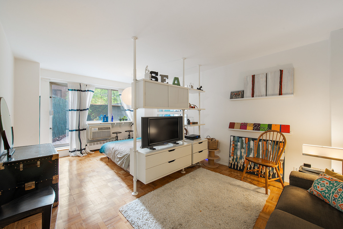 A Yorkville studio squeezes three rooms into one