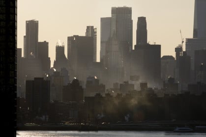 Steam emitting from building rooftops during winter in New York City. Steam emitting from building rooftops during winter in New York City.