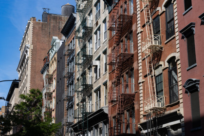 Residential Buildings with Fire Escapes along a Street in SoHo of New York City