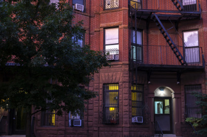 Red brick apartment building in Park Slope in the evening