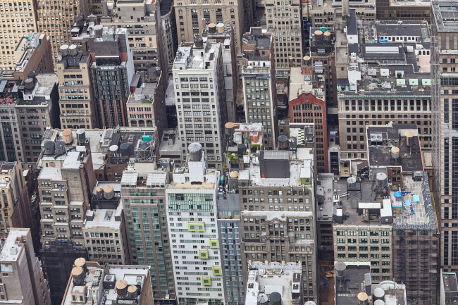 Aerial picture of Manhattan with many rooftop water towers, New York City, USA.