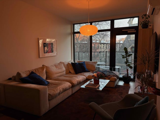 image3 small.jpeg A cozy living room lit in orange light.
