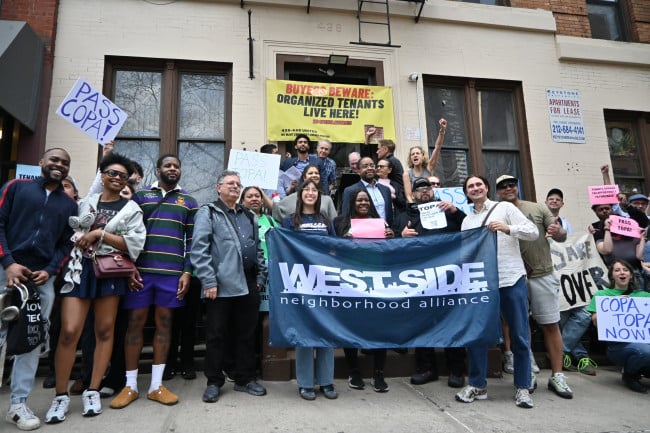 Tenants of 438 and 440 West 45th Street spoke in support of two bills that would give tenants, nonprofits, and community land trusts first crack at buying their apartment buildings. Tenants of 438 and 440 West 45th Street gathered on the stoop of the apartment building at 438.