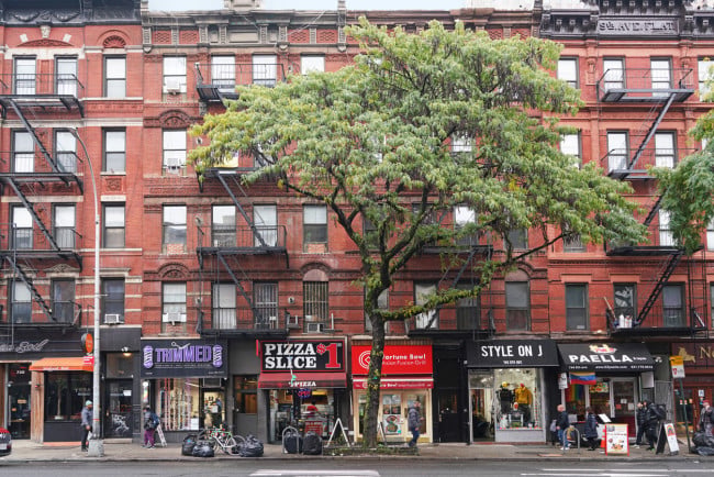 Manhattan apartment buildings with stores on the ground level