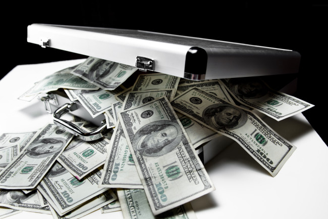 iStock-suitcase full of money.jpg image