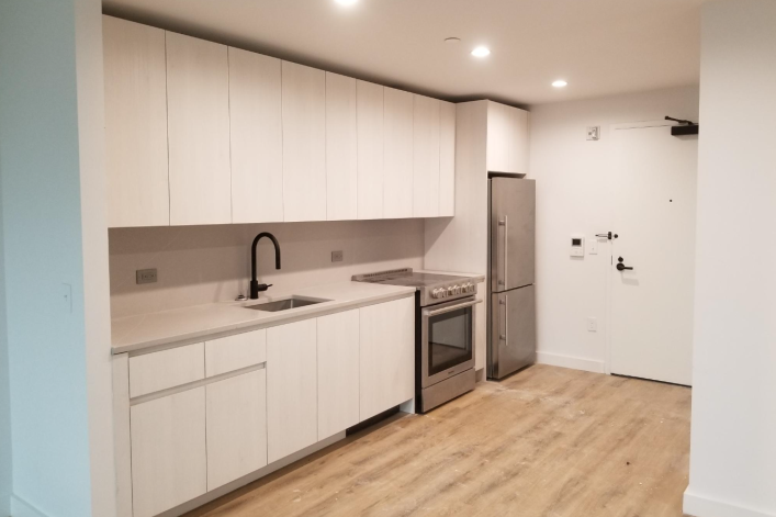 interior galley kitchen of apartment building in Queens