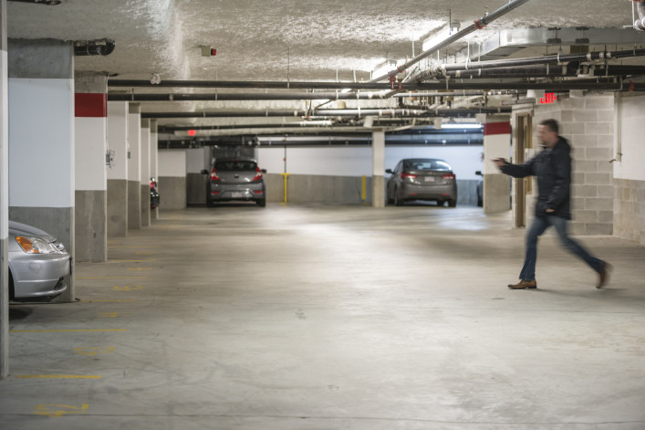 Man Rushing To Car In Parking Garage 