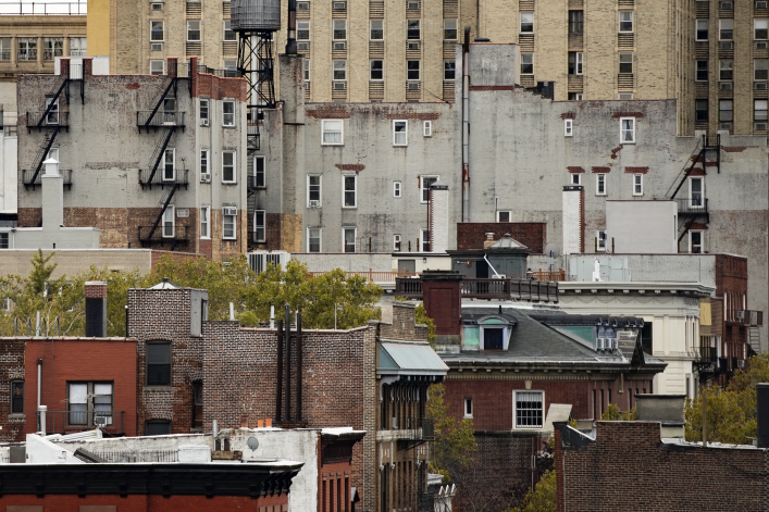 New York's skyscrapers with water tanks on the roof of some buildings. Manhattan, New York City, USA.