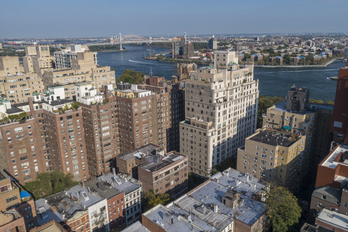 Aerial panoramic scenic view over Upper East Side Manhattan and East River toward Astoria, Queens, New York, USA
