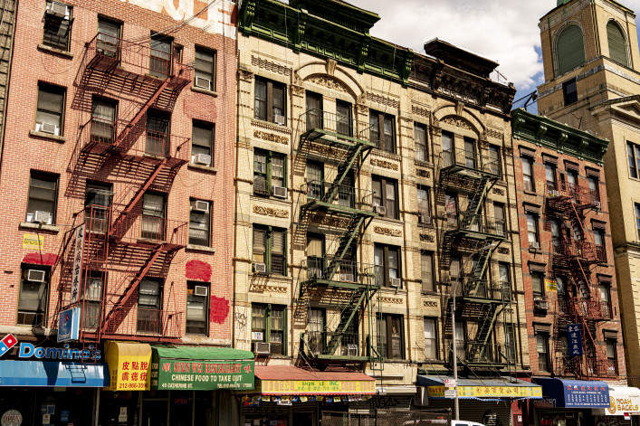 Low rise apartment buildings with ground-floor storefronts