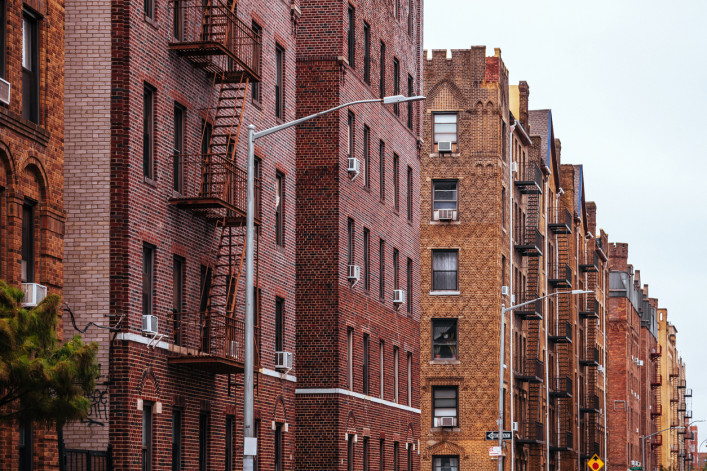 A row of Brooklyn apartment buildings.