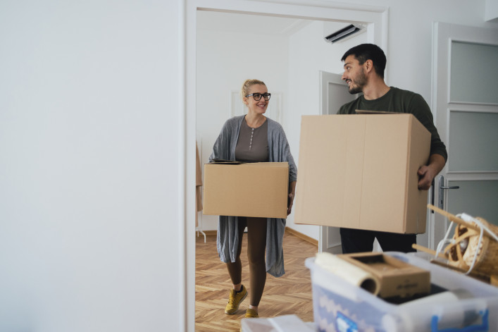 A couple with moving boxes