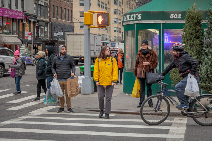 New Yorkers waiting to cross Lexington Avenue in Manhattan.