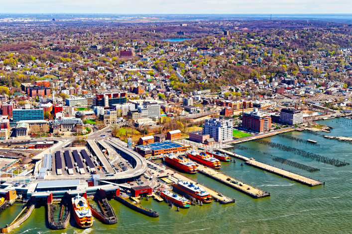 Aerial view of Staten Island St George Ferry terminal. Manhattan Area, New York of USA. Skyline and cityscape with skyscrapers at United States of America, NYC, US. American architecture.