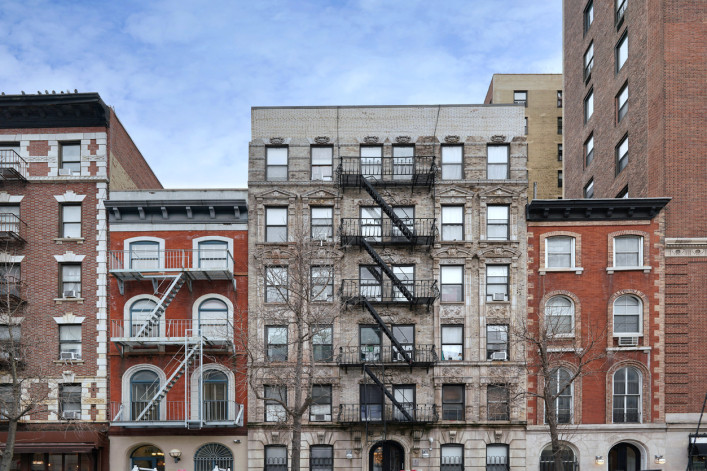 NYC apartment buildings with fire escapes