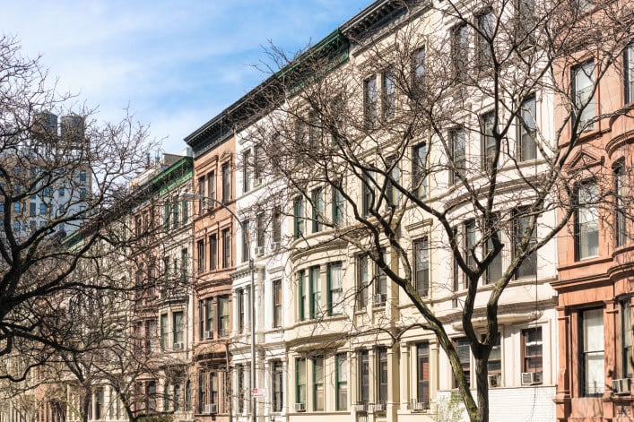 A Manhattan street of traditional apartment buildings.