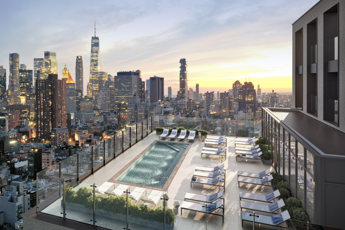 rooftop pool and loungers with NYC buildings to horizon