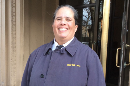 Gloria standing sentry in front of her building.