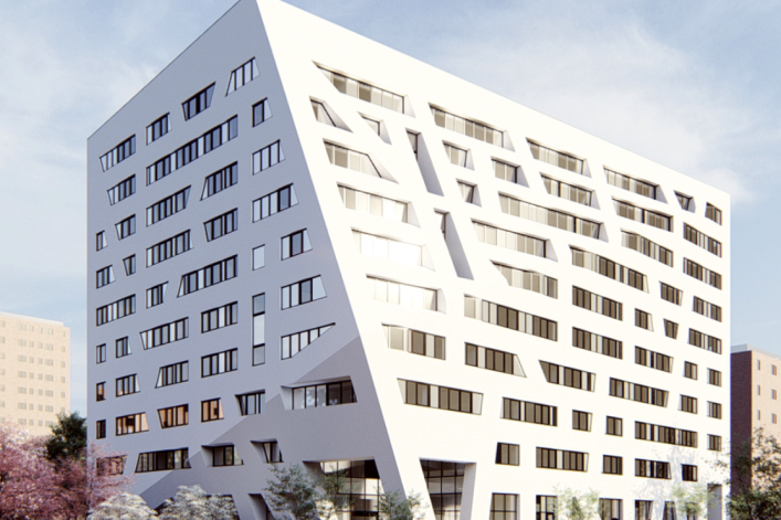 White exterior of modern housing complex at 57 Marcus Garvey Blvd, Brooklyn,