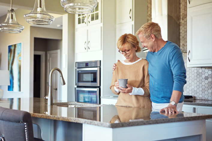 empty nesters in modern kitchen