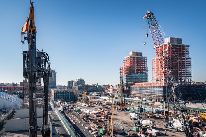 Construction site with new apartment buildings and cranes in Gowanus, Brooklyn, NY