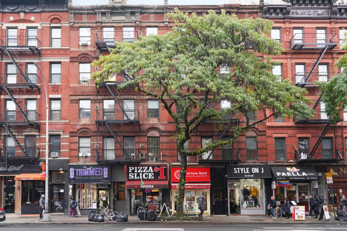 Manhattan apartment buildings with stores on the ground level