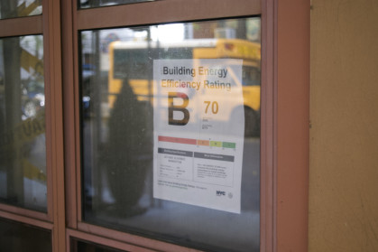 Sign in window of building for energy efficiency rating Grade B