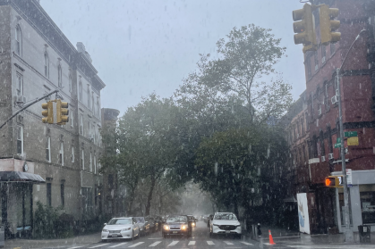 Heavy rain falls on the corner of Seventh Avenue and 5th Street at around 12:30 p.m. in Park Slope, Brooklyn.