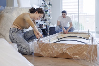 couple assembling a couch