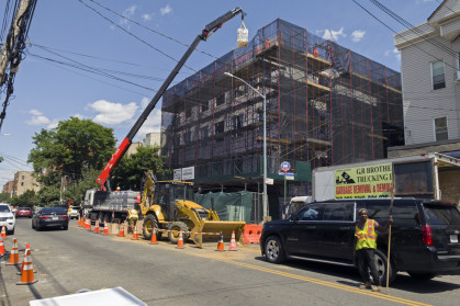 Construction work with a crane on new building in the Bronx NY