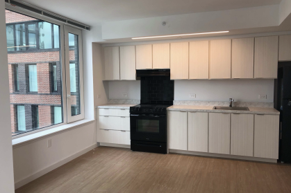 Kitchen at H1H2 with window and stove