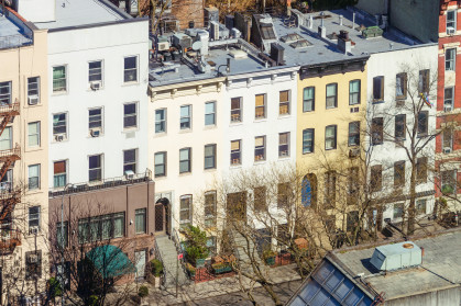 A high angle view of a traditional residential street Hell's Kitchen, Midtown Manhattan in New York City.