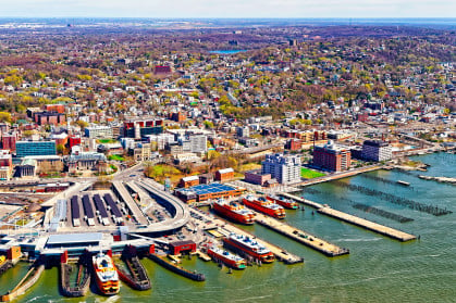 Aerial view of Staten Island St George Ferry terminal. Manhattan Area, New York of USA. Skyline and cityscape with skyscrapers at United States of America, NYC, US. American architecture.