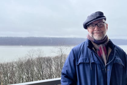 Brian on the balcony of his Riverdale condo