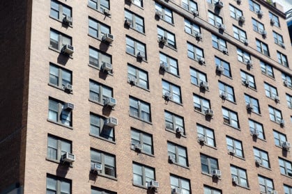 NYC apartment building with AC units