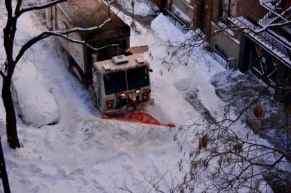 plow digs out a West Village street after a blizzard in 2016