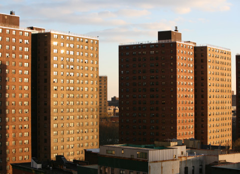 Sunset light on public housing project in Harlem, high angle view, New York City, NY, USA.